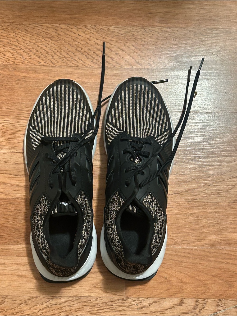 Women's Black Knit Lace-Up Athletic Sneakers; Adidas RapidaRun knit sneakers